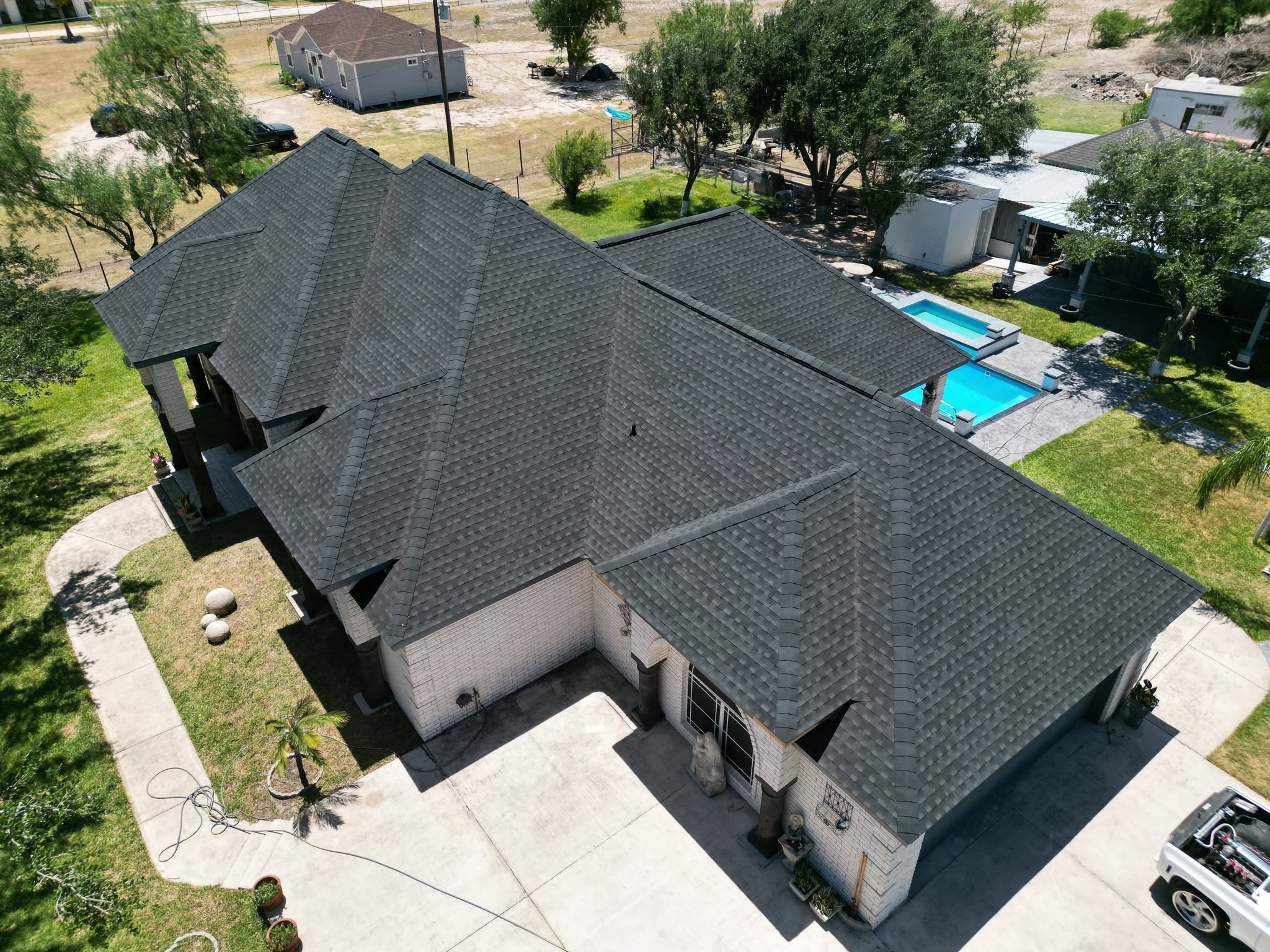 Completed Charcoal shingle roof on a home in Palmview, Texas